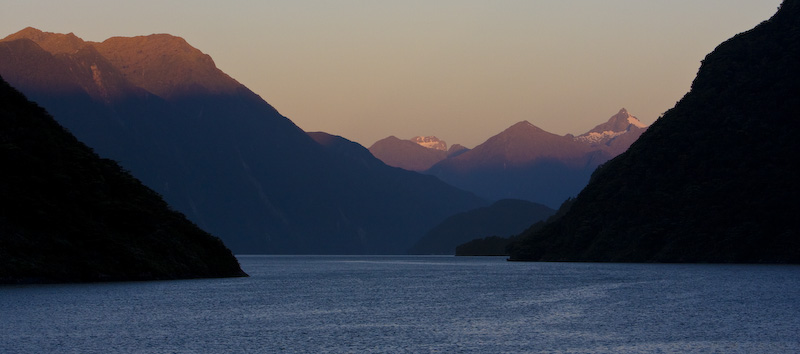 Mountains Above Doubtful Sound At Sunrise